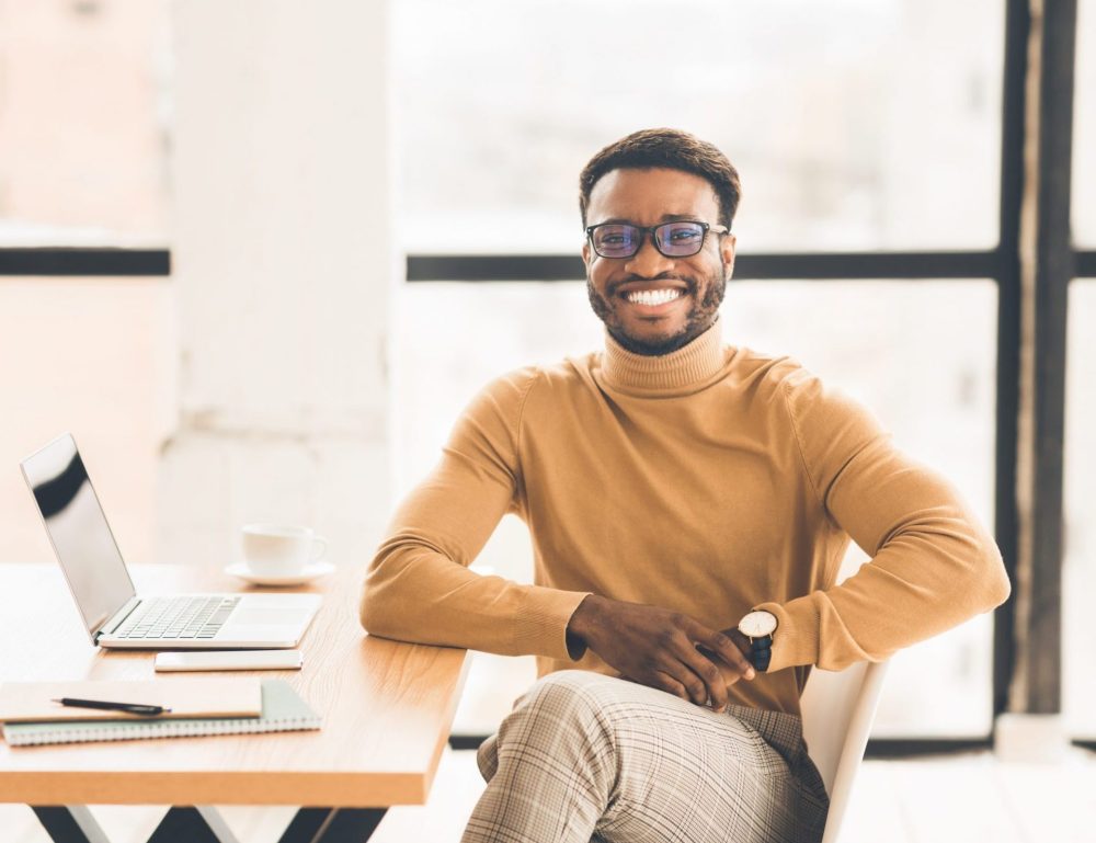 portrait-of-happy-black-manager-looking-at-camera-EAPQ4YL-scaled-e1589488586209.jpg